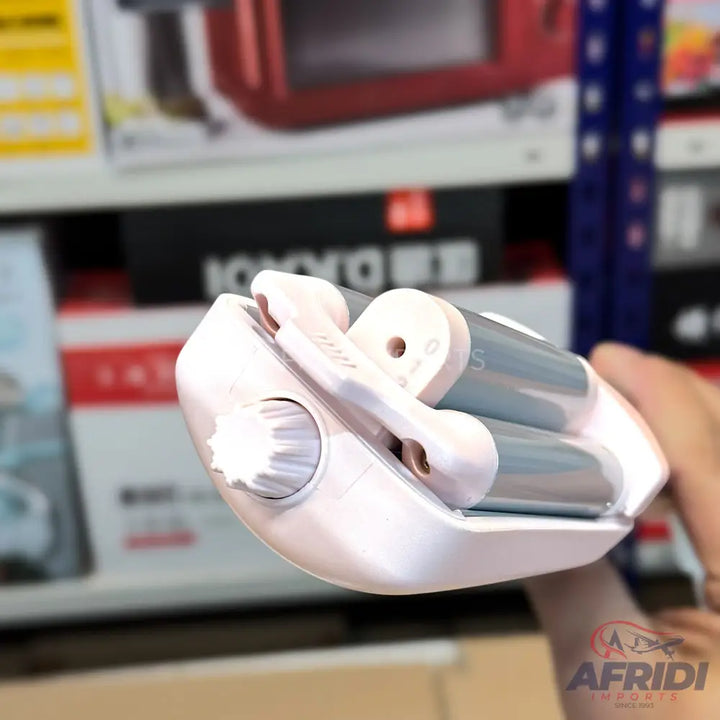 Light pink, portable foot file with two grey rotating rollers for exfoliation.