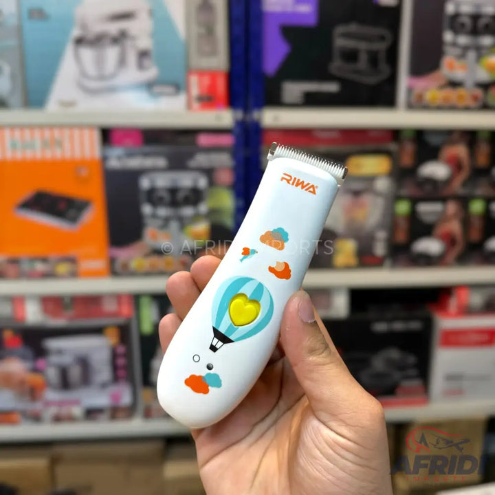 A white child’s hair clipper with colorful hot air balloon and cloud designs.