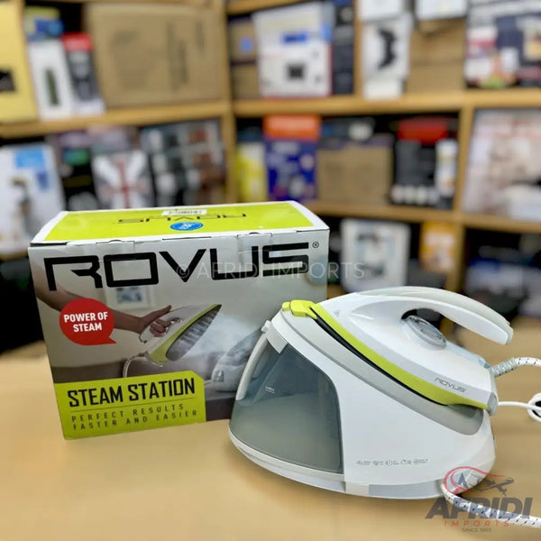 A white and lime green steam iron with a detachable water tank and a compact design.