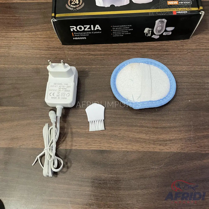 White electric shaver with accessories.