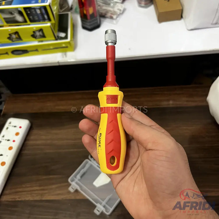 A yellow and red insulated screwdriver with a removable bit.