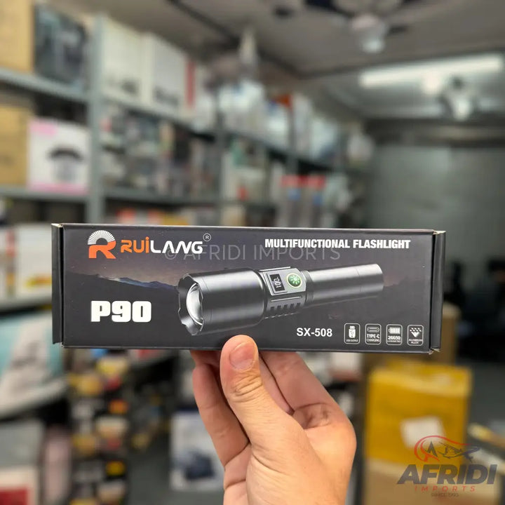 Black ’Rui Lang P90’’ multifunctional flashlight in its packaging.