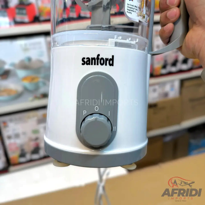 White food chopper with a clear top, gray control dial, and three speed settings.