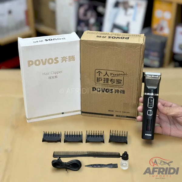 A black electric hair clipper with multiple guide combs and accessories.