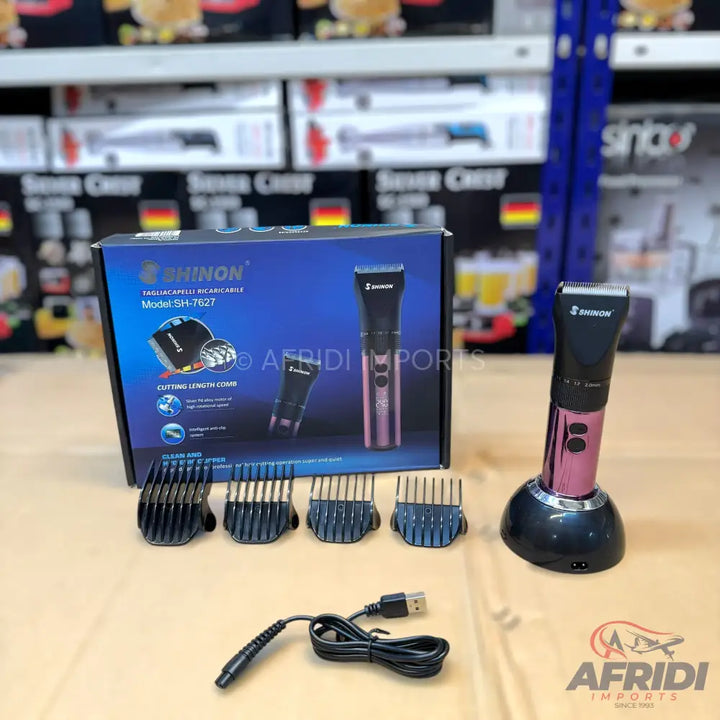 A cordless hair clipper set with multiple attachments and a charging dock.