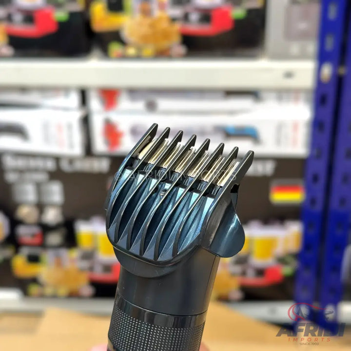 Black hair clipper with an adjustable guide comb