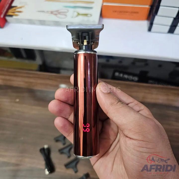 A metallic red, rechargeable hair trimmer with a digital display showing ’99’’ and an exposed blade.