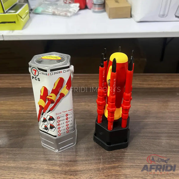 A set of red and yellow insulated screwdrivers, some packaged in a clear plastic container and others displayed in a black hexagonal stand.