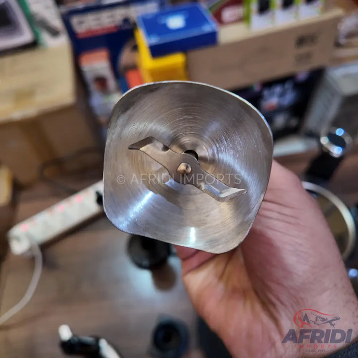 Stainless steel immersion blender head with a two-pronged blade.