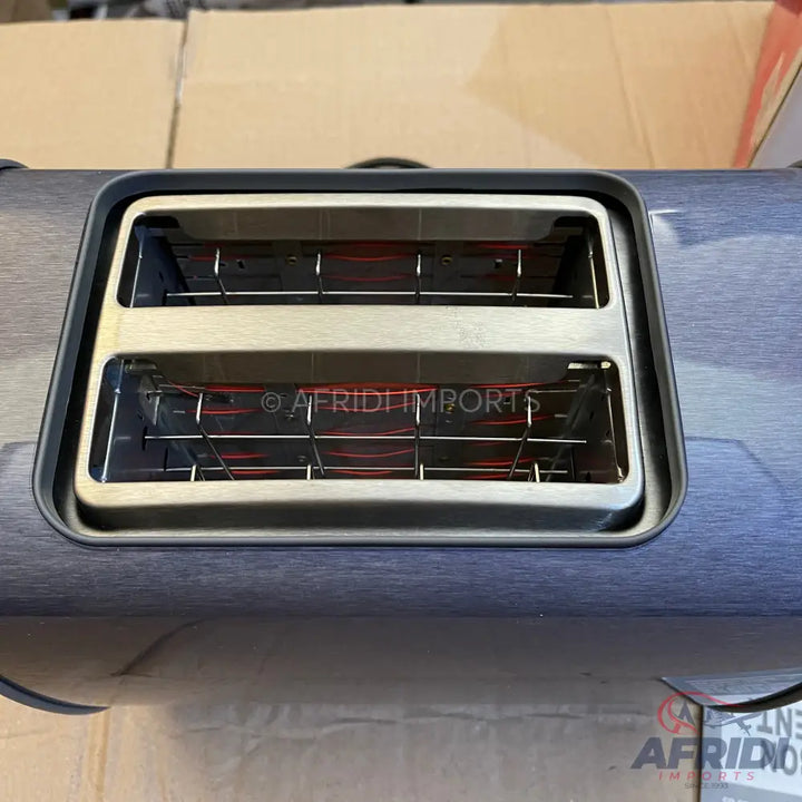A two-slice toaster with glowing red heating elements.