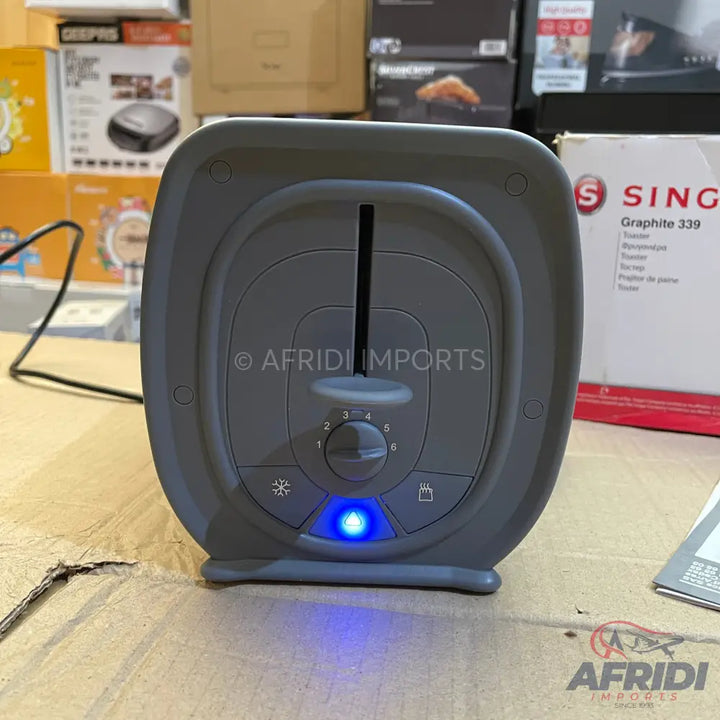 Gray plastic toaster with a blue illuminated button.