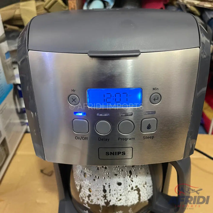 A stainless steel and black coffee maker with a digital display and multiple brew settings.