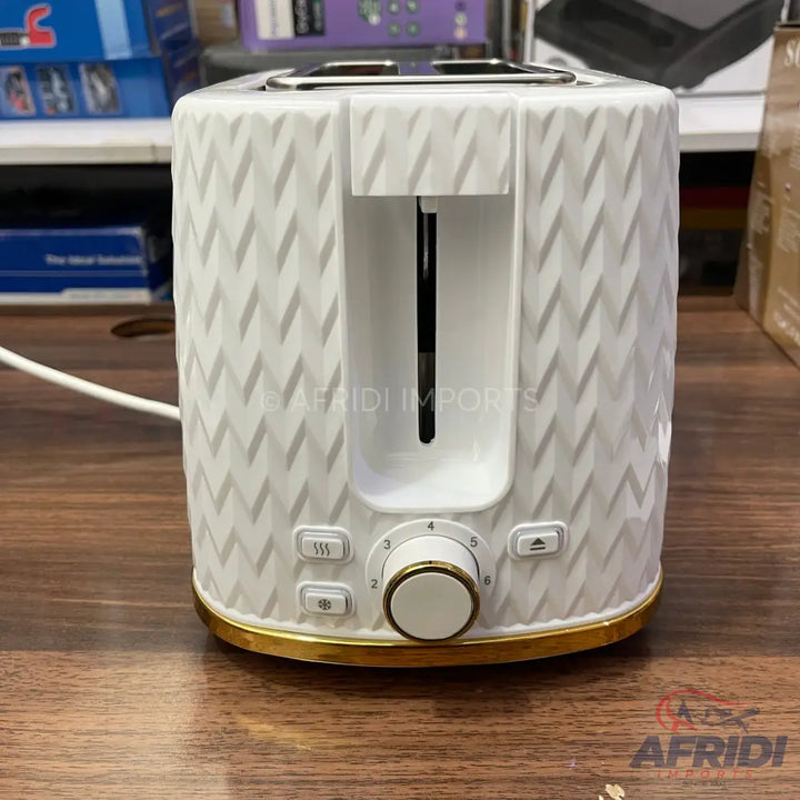 White and gold two-slice toaster with a textured chevron pattern.