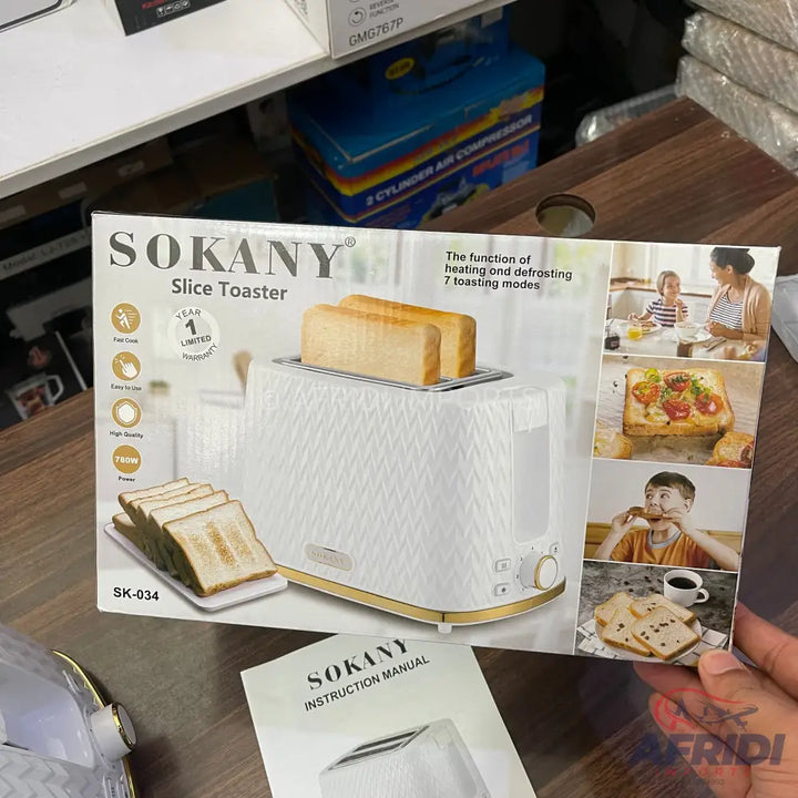 A white and gold two-slice toaster with a diamond-patterned exterior, featuring multiple toasting modes and a one-year limited warranty.