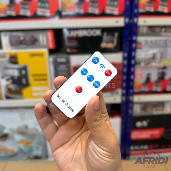 White remote control with blue and red circular buttons.