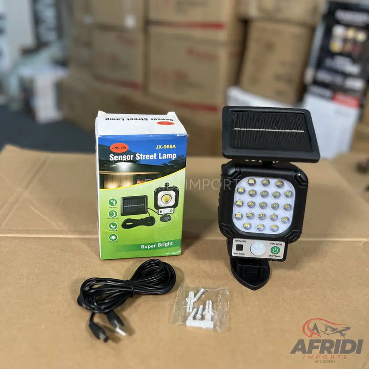 A solar-powered sensor street lamp with an external solar panel, LED light, and motion sensor.