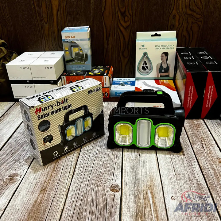 Portable solar work light with three LED panels, two yellow and one white.
