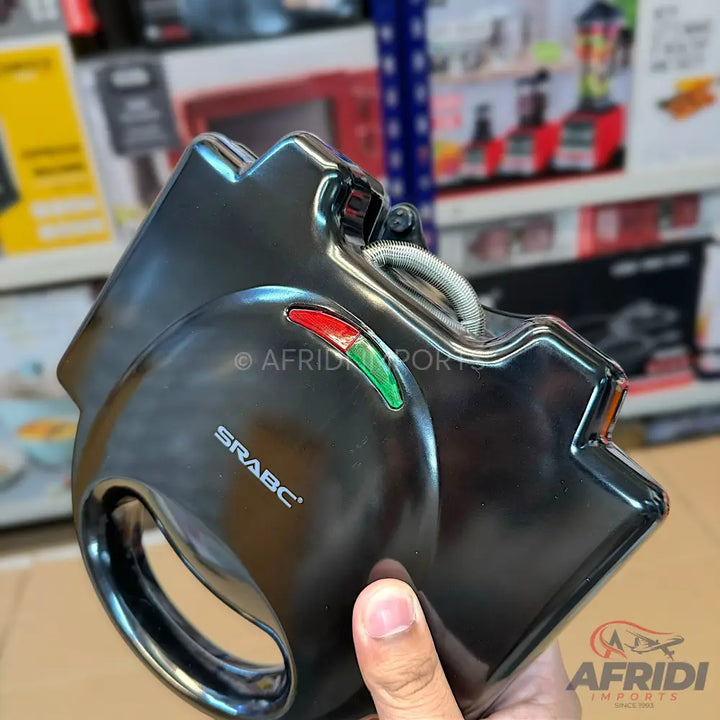 Black electric sandwich maker with indicator lights.