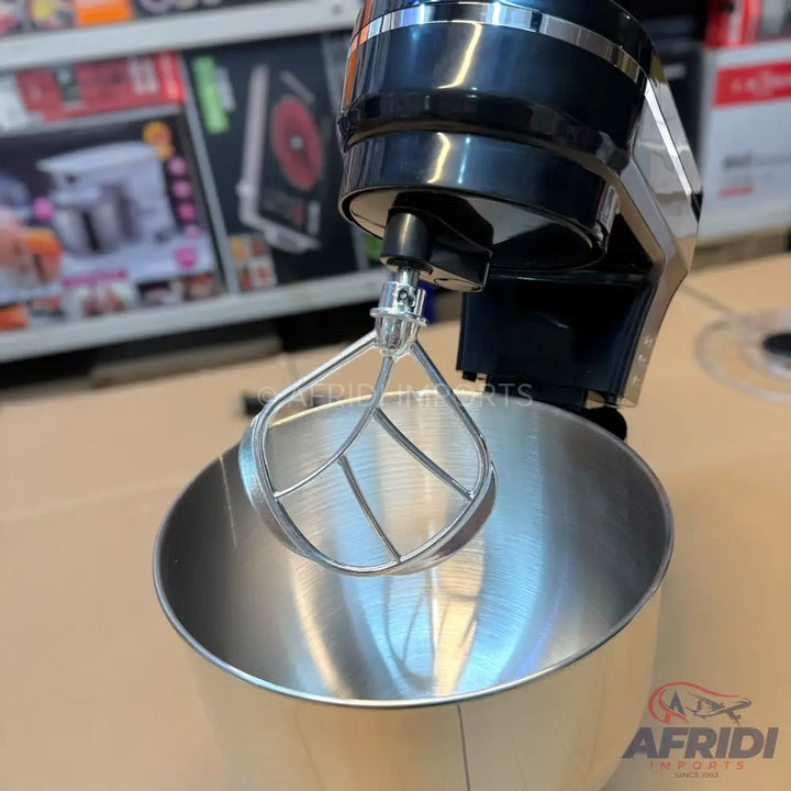 Black stand mixer with a stainless steel bowl and paddle attachment.