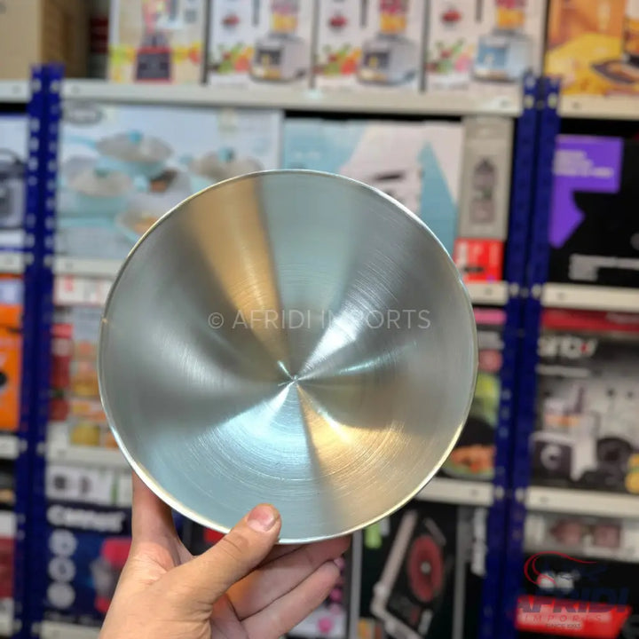 Shiny metallic cooking pot lid with a brushed finish.