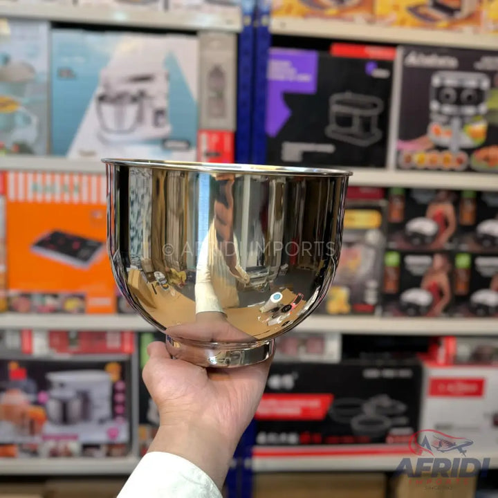 A shiny, metallic mixing bowl with a rounded bottom and a slight lip.