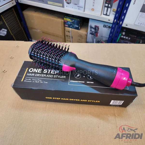 Black and pink one-step hair dryer and styler with a brush head.