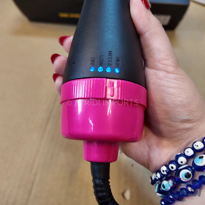 Black and pink hair styling tool with heat settings.