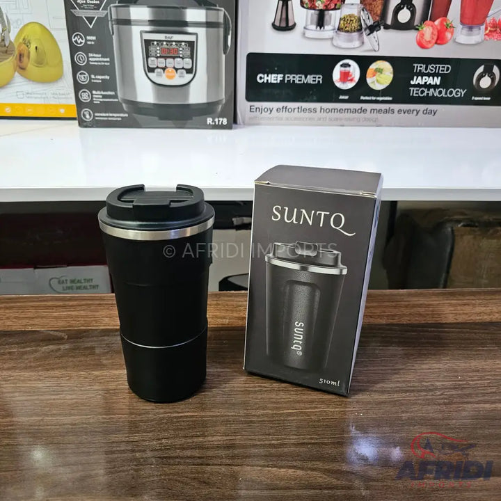 Black travel mug with a silver rim and a matching black box.