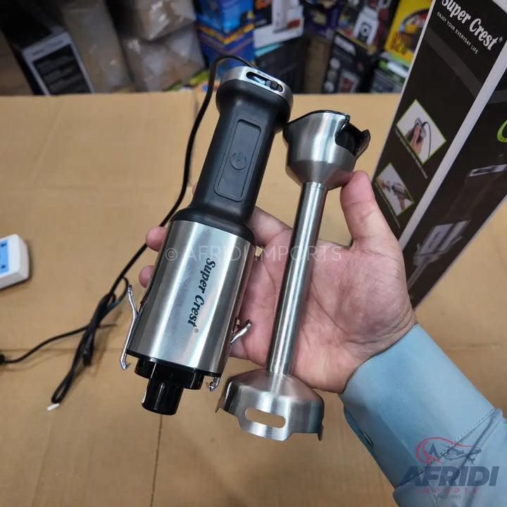 A handheld immersion blender with a detachable stainless steel blending shaft.