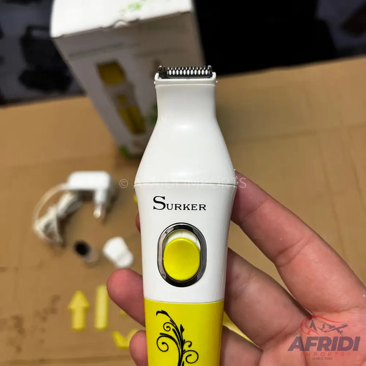 White and yellow electric hair trimmer with a black blade.