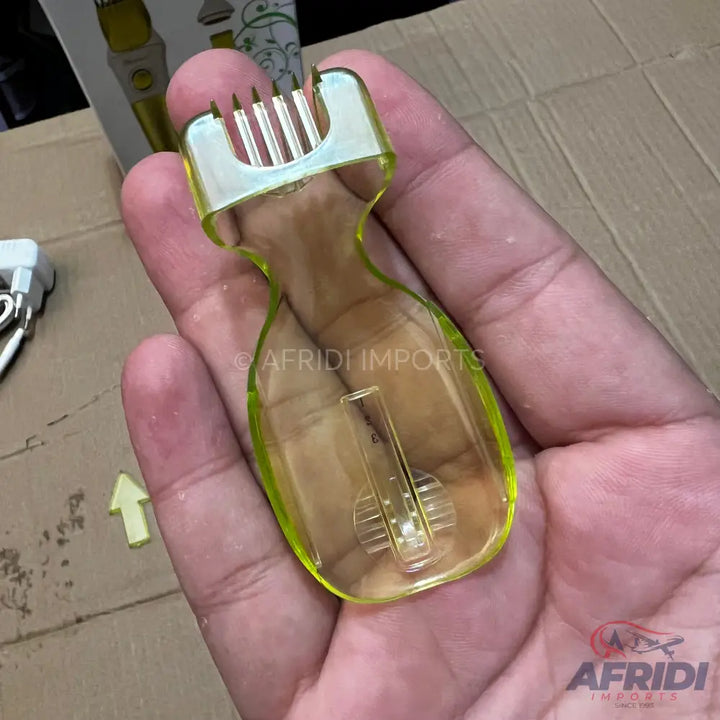 Translucent yellow plastic hair trimmer guard with a comb-like top and an internal adjustable mechanism.