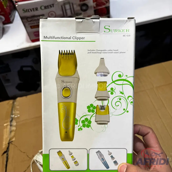 A boxed ’Surker’ multifunctional clipper set with interchangeable heads.