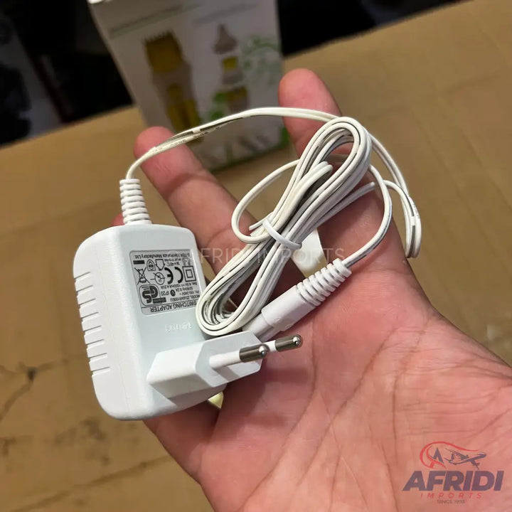 White AC power adapter with a European-style two-prong plug and an attached cord.