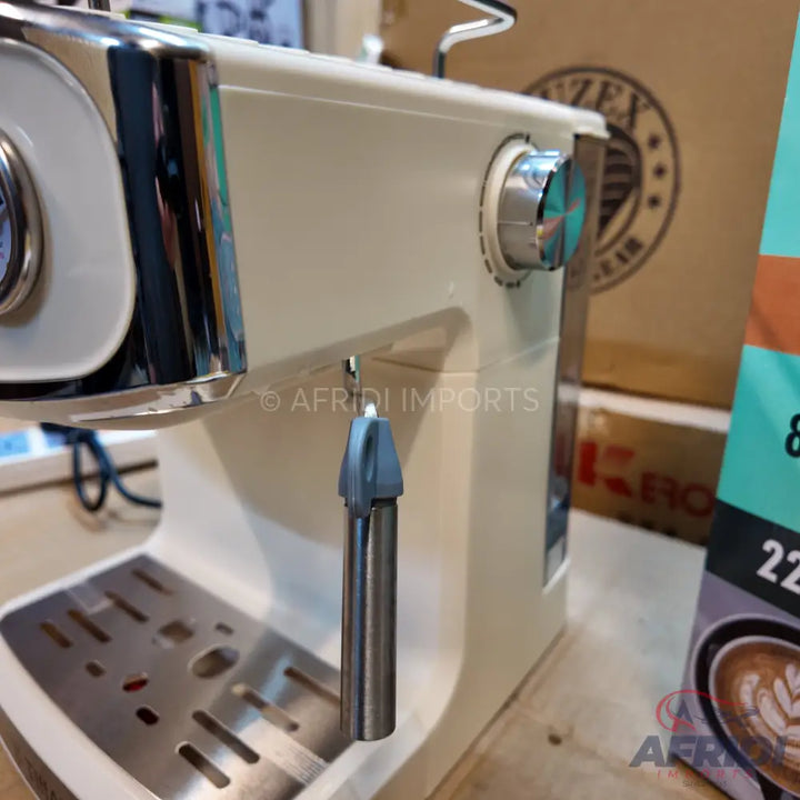 Cream-colored espresso machine with chrome accents and a steam wand.