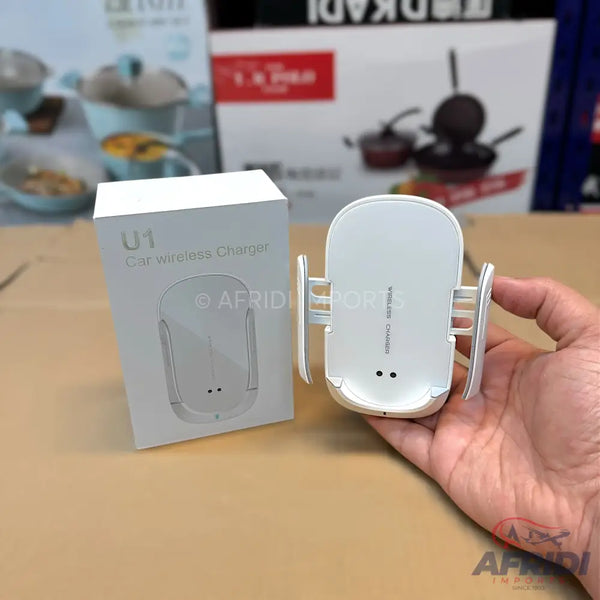 White car wireless charger with automatic clamping arms.