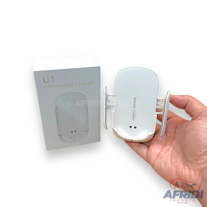 White U1 car wireless charger with automatic clamping arms.