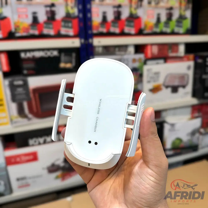 A white wireless phone charger with adjustable side grips.