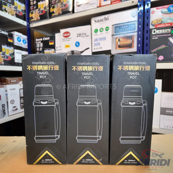 Three black boxes of stainless steel travel pots