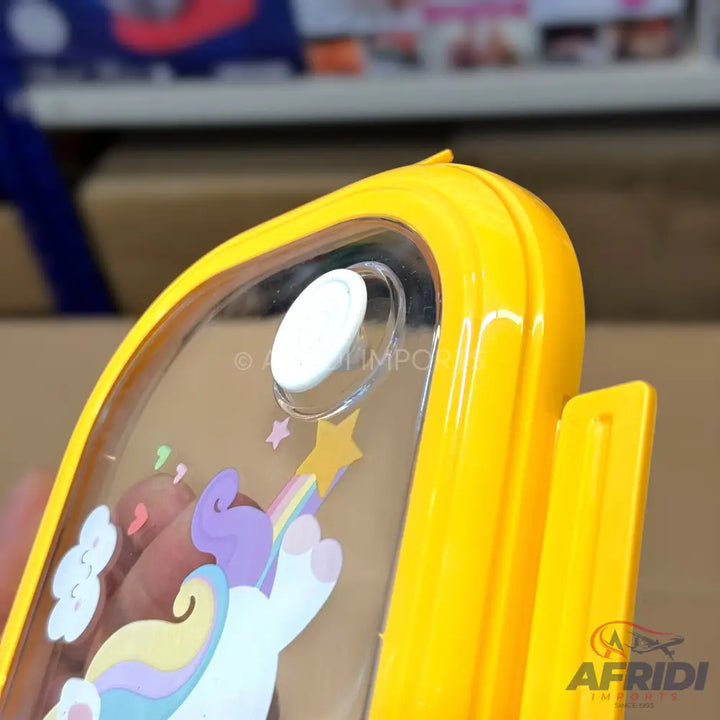 Yellow and clear plastic lunchbox with a unicorn and rainbow design.