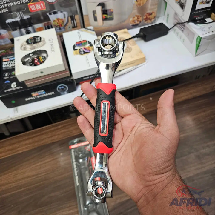 Multi-function universal socket wrench with a black and red ergonomic handle.