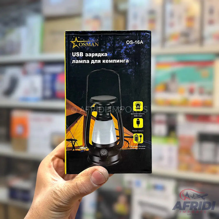 A black camping lantern with USB charging capability.