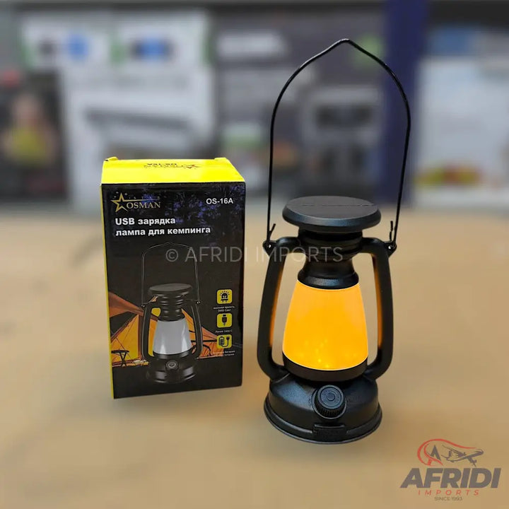 A black and yellow solar-powered LED camping lantern with a USB charging port.