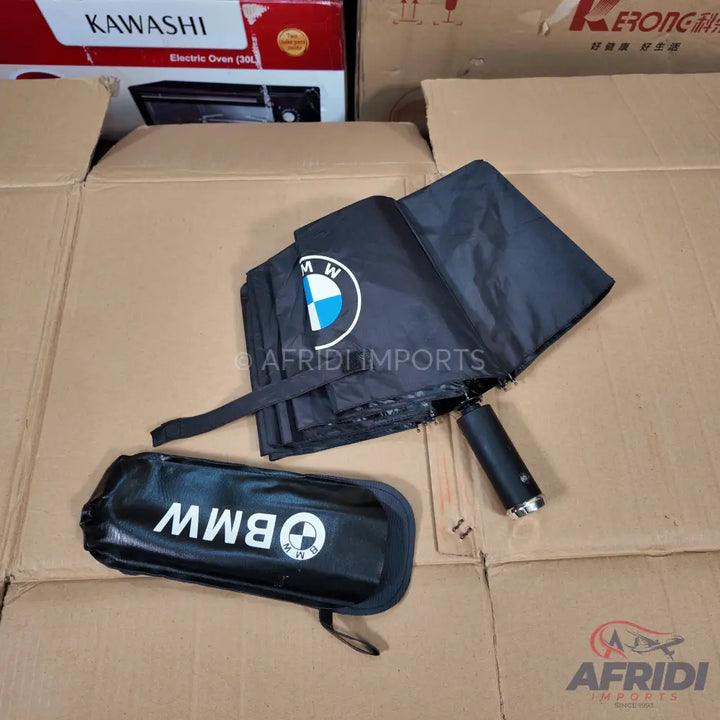 Black BMW-branded umbrella with its matching storage sleeve.