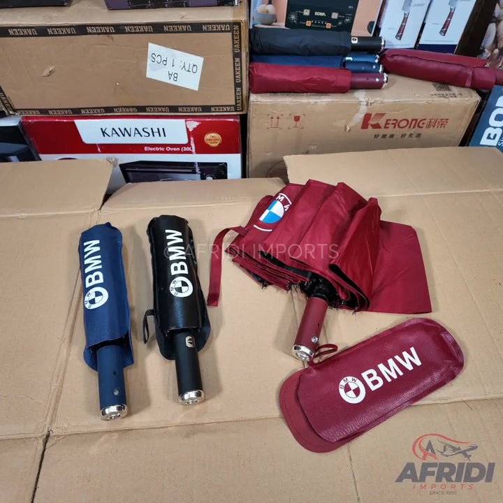 BMW-branded compact umbrellas in various colors
