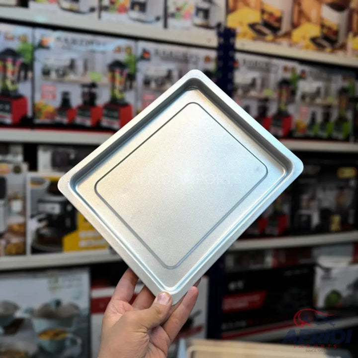 Silver square baking pan with raised edges