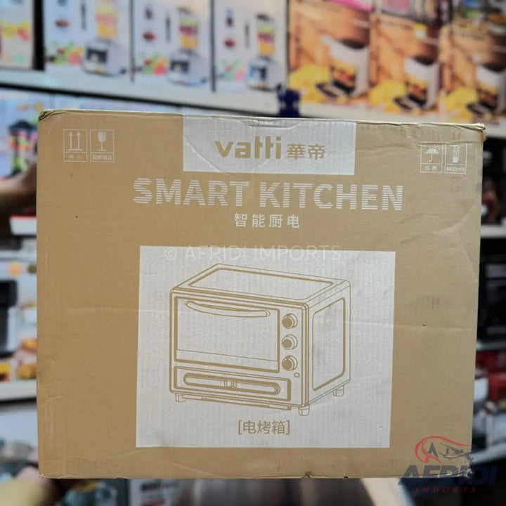 A brown cardboard box containing a ’Vatti Smart Kitchen’ toaster oven.