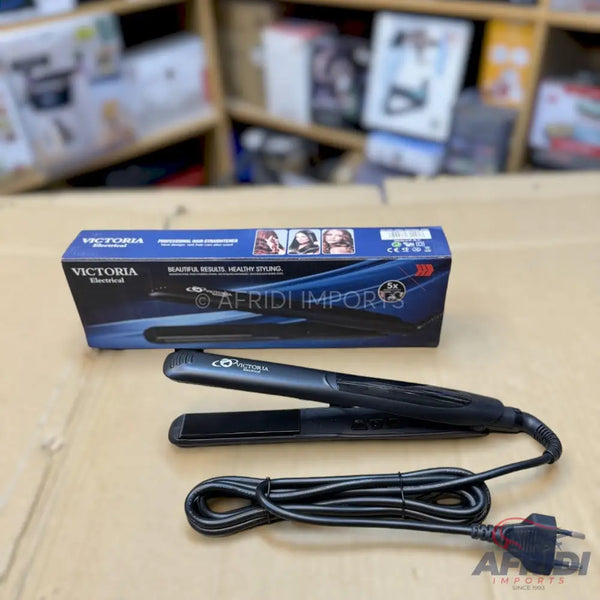 Black hair straightener and its packaging box.