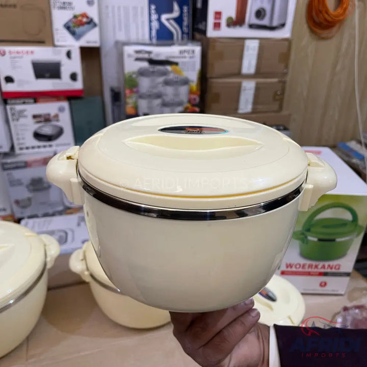Cream-colored insulated food container with a handle on each side.