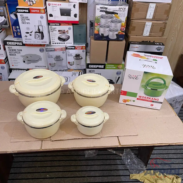 A set of four cream-colored insulated food warmers with lids.