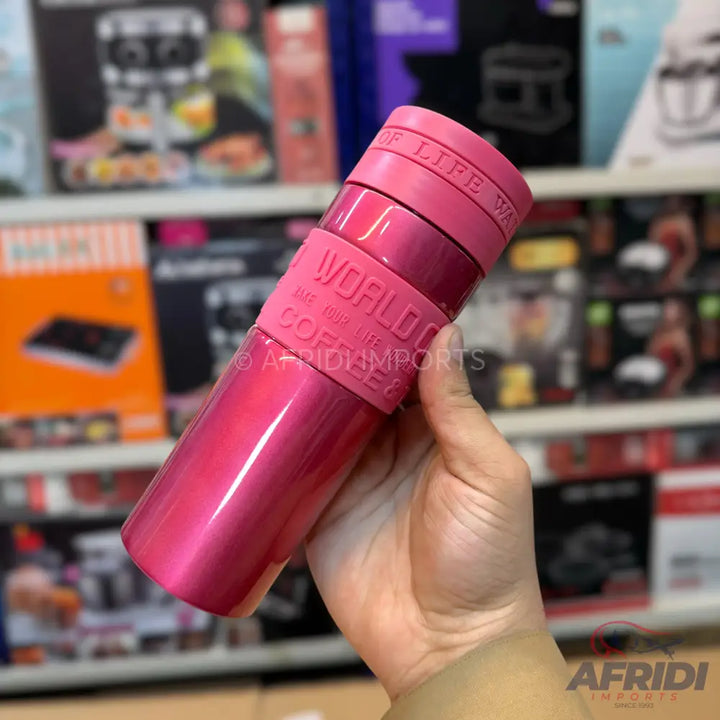 Pink insulated coffee tumbler with a silicone grip.